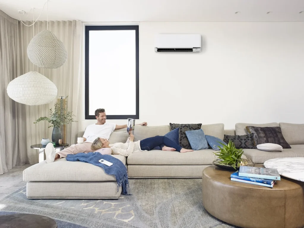 Premium living room with a real wall-mounted split system air conditioner installed above the living area